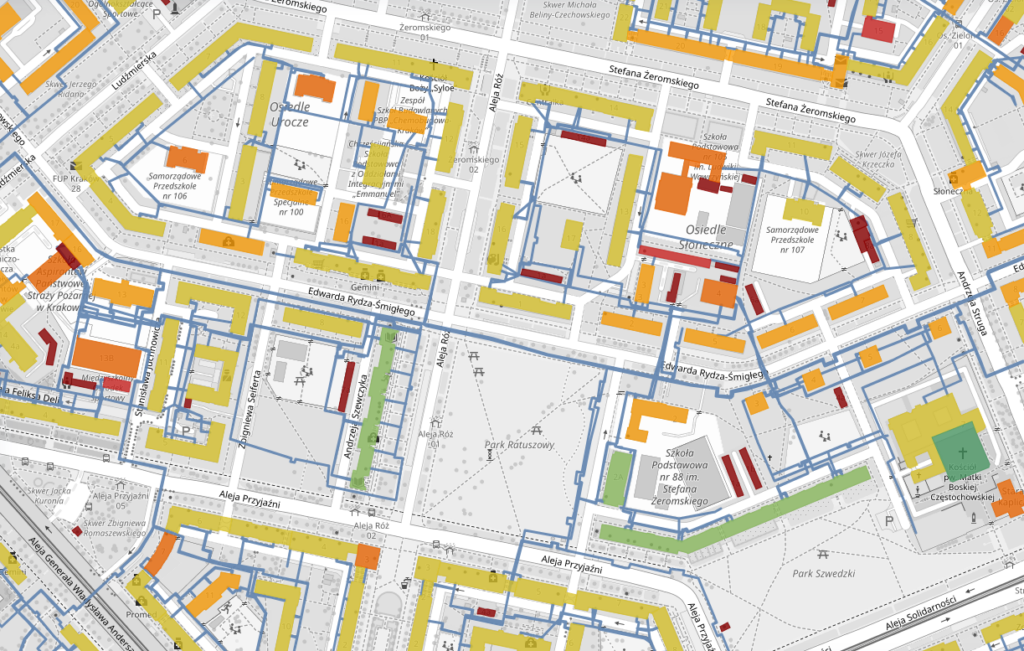 Mapa budynków z zaznaczonymi przebiegami sieci ciepłowniczej oraz węzłami, pokazująca przypisane obiekty w obszarze miasta i gminy.